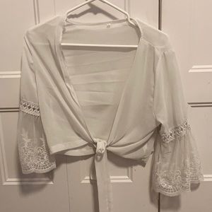 White blouse with lace on the sleeves